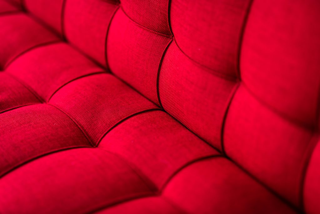 For the comfort you deserve. Stylish red couch sofa. Copy space